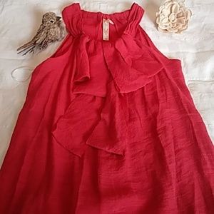 Dark burnt orange knit blouse.